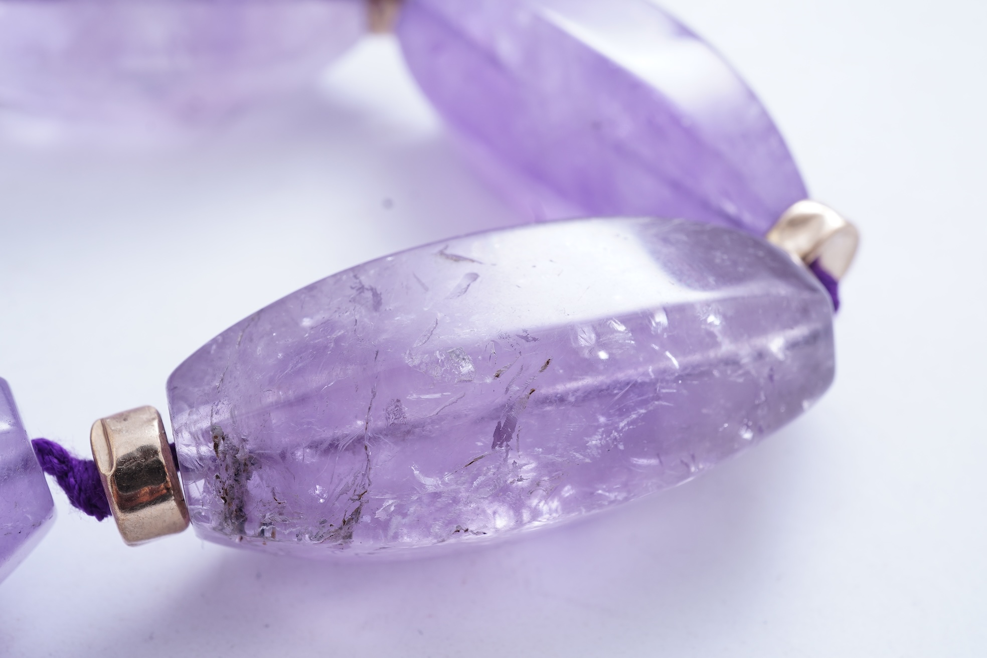 An amethyst and gold necklace